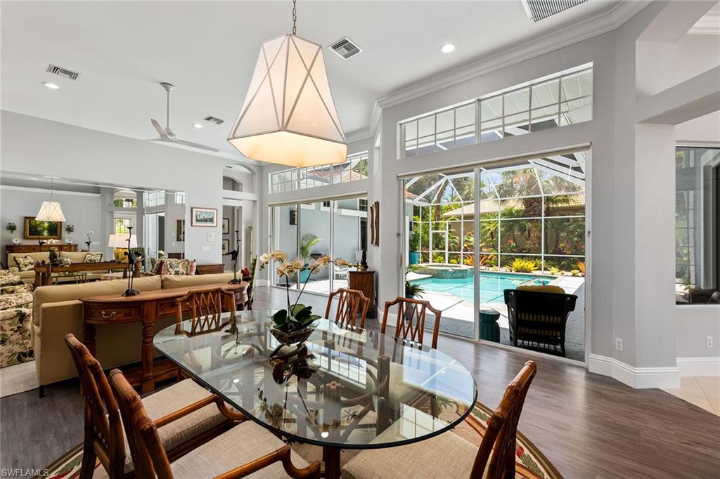 566 Eagle Creek Drive Naples, FL 34113 - Photo 3 of 25 a view of a dining room with furniture window and outside view