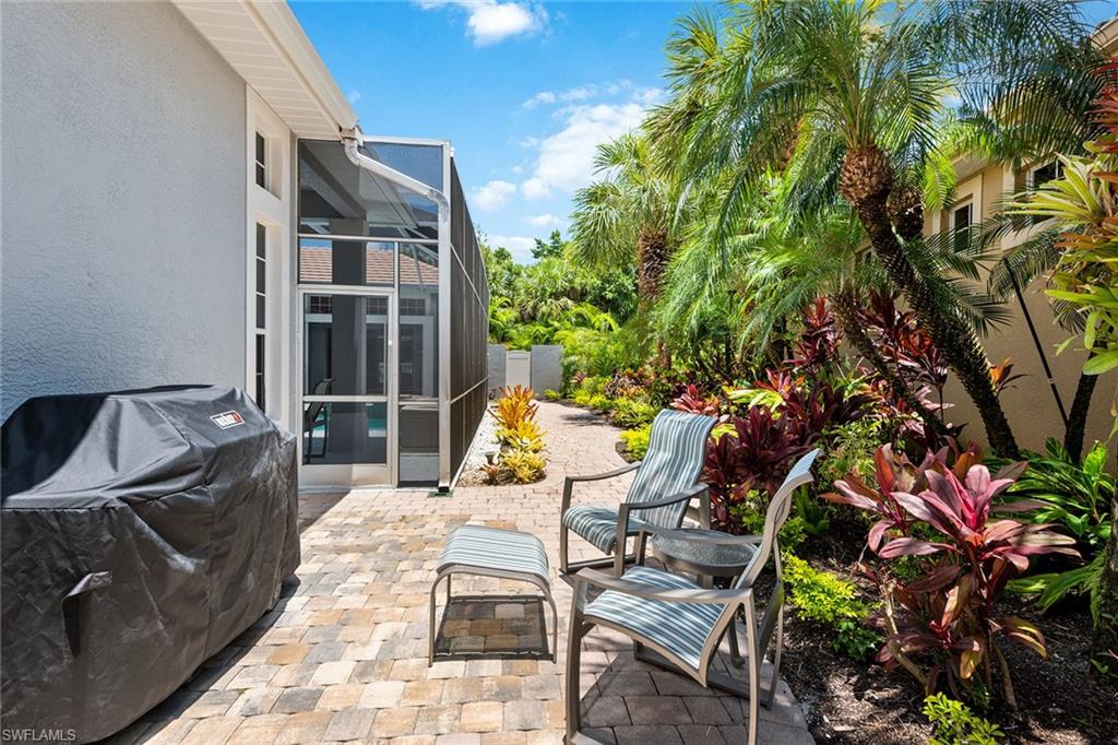 566 Eagle Creek Drive Naples, FL 34113 - Photo 10 of 25 a view of balcony with chairs and iron stairs