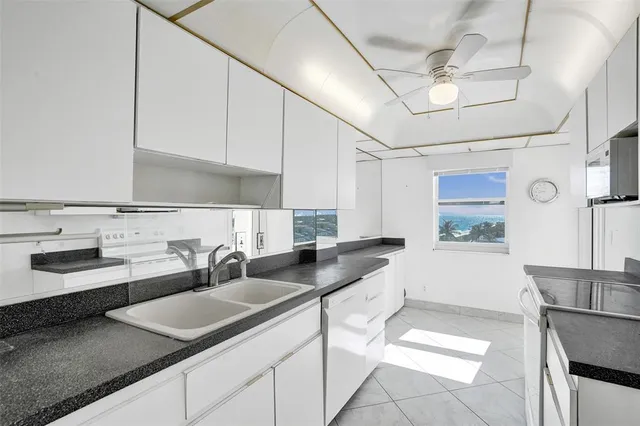 a kitchen with a sink and a cabinets