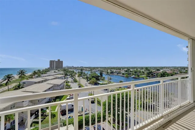 a view of a balcony with wooden floor