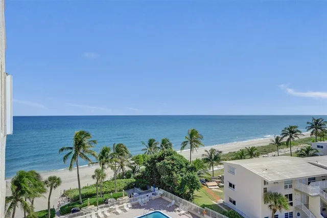 a view of a terrace with a table and chairs