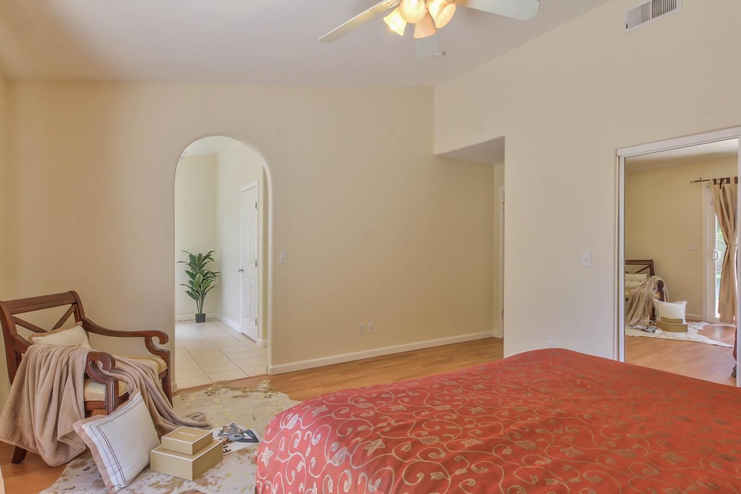 5502 Mesa Road Gilroy, CA 95020 - Photo 14 of 23 a bedroom with a bed and a mirror