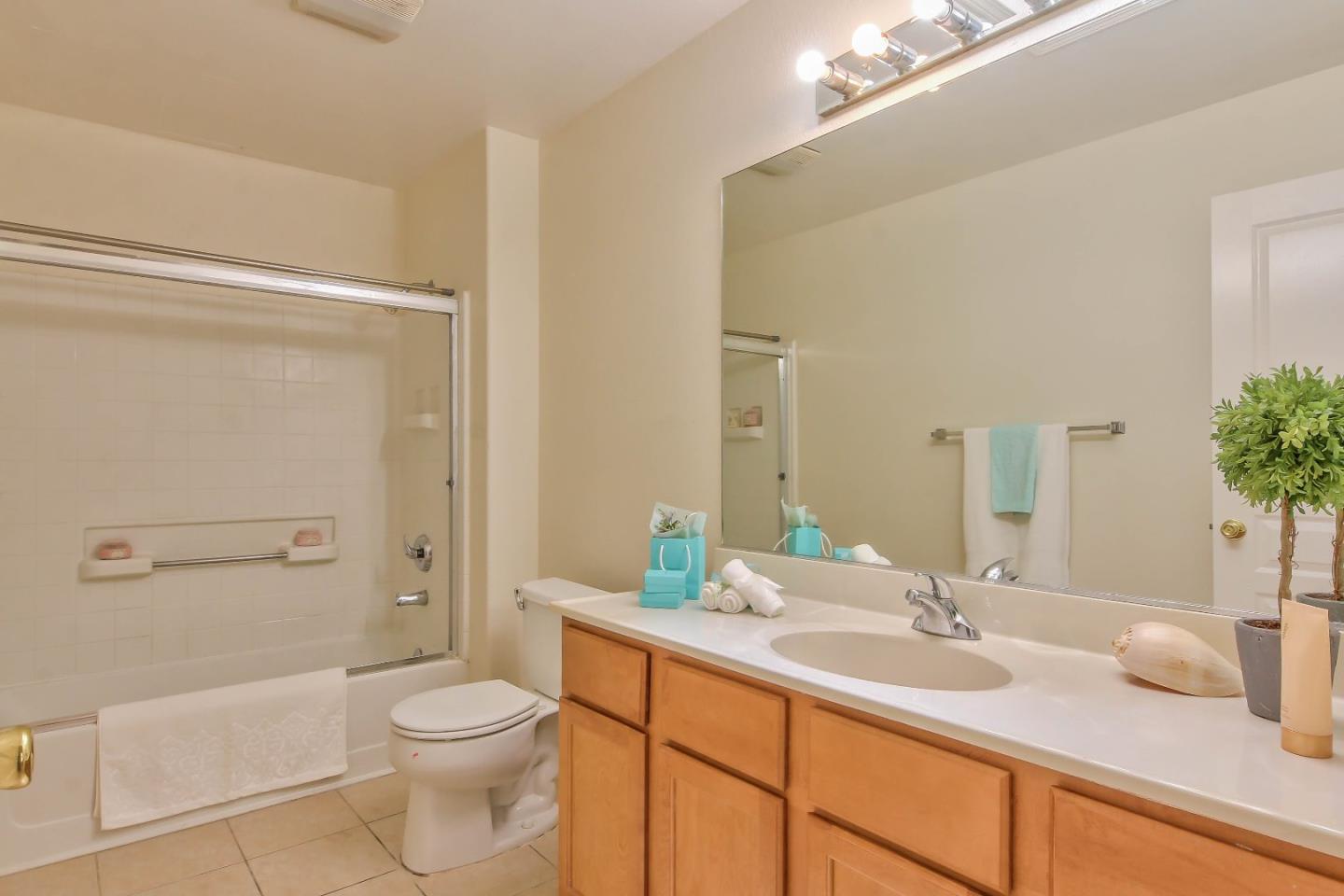 5502 Mesa Road Gilroy, CA 95020 - Photo 21 of 23 a bathroom with a granite countertop sink toilet and shower