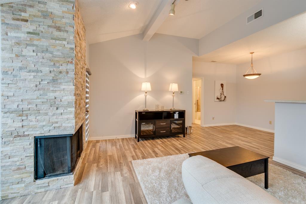 2100 Randy Snow Road, Unit 412 Arlington, TX 76011 - Photo 6 of 32 an empty room with wooden floor fireplace and windows