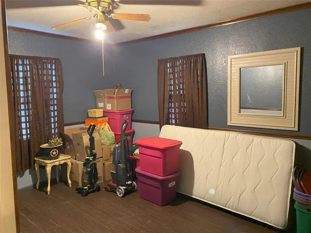 a kitchen with a sink a stove and cabinets