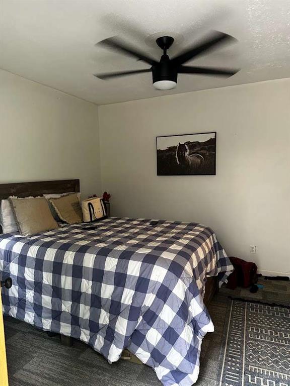 415 Walton Road Barnesville, GA 30204 - Photo 6 of 12 a bedroom with a bed and a lamp on the dresser