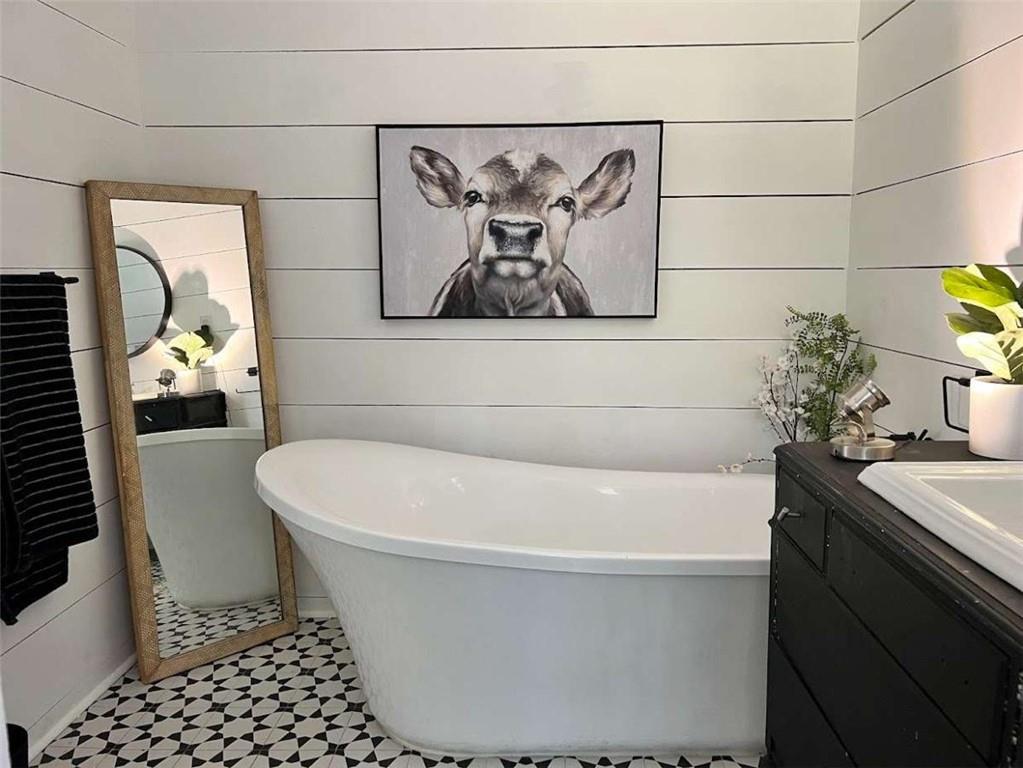 415 Walton Road Barnesville, GA 30204 - Photo 7 of 12 a white bath tub sitting in a bathroom