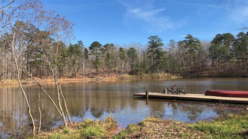 415 Walton Road Barnesville, GA 30204 - Photo 10 of 12 a view of a lake with a mountain in the background