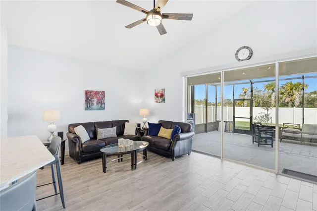 a bedroom with furniture and a flat screen tv