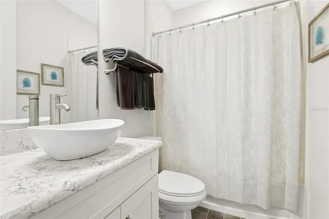 a living room with patio area and a glass door