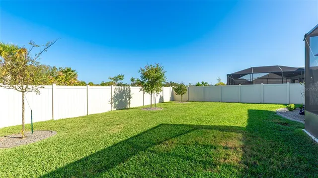 an aerial view of a swimming pool and outdoor space