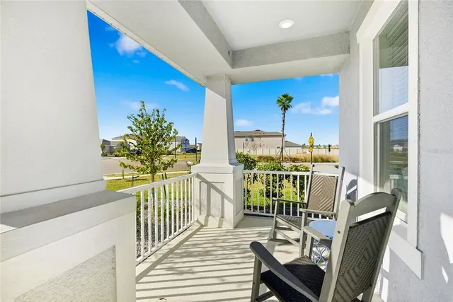 a view of a dining room with furniture and window
