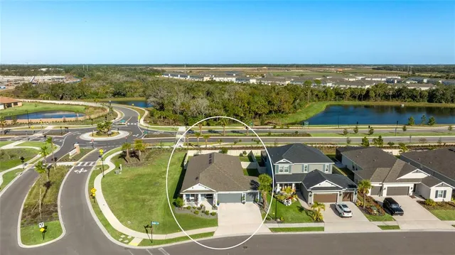 a view of a lake with a house in the background