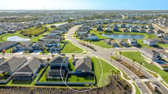 a living room with furniture and a book shelf