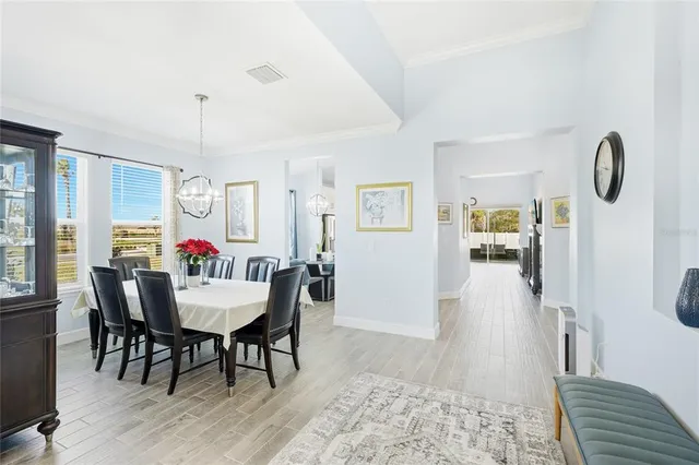 a view of a dining room with furniture window and outside view