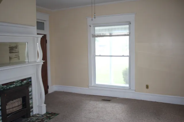 a view of empty room with front door