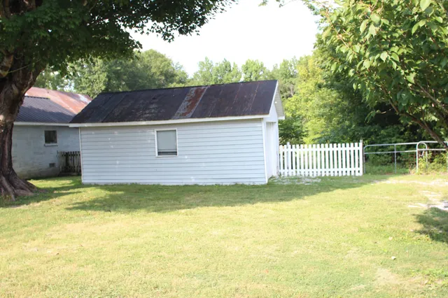 a view of backyard with a garden and plants
