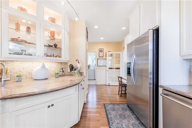 a spacious bedroom with a bed and a chandelier