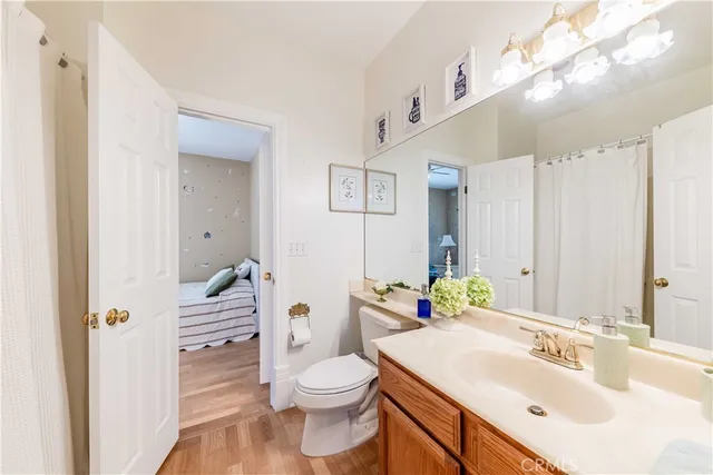 a view of two chairs and table in the balcony
