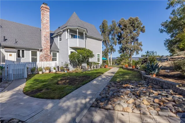 a view of a yard with large trees