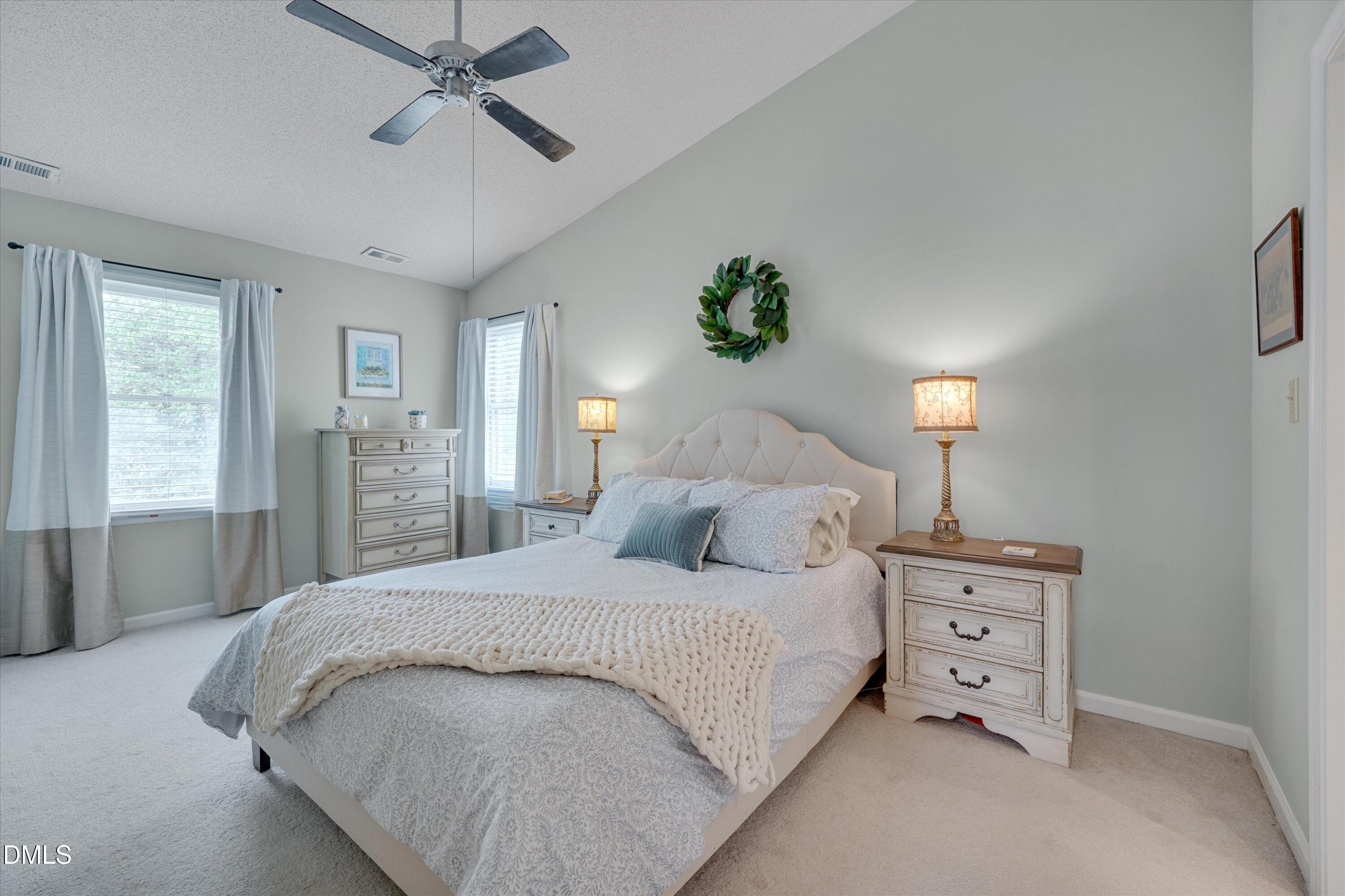 3301 Lassiter Street Durham, NC 27707 - Photo 18 of 32 a bedroom with a bed and a dresser