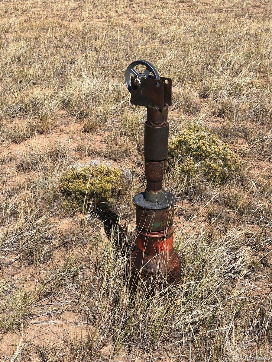 Lot 46 River Ridge Ranch Walsenburg, CO 81089 - Photo 6 of 17 a lamp that is on a brick wall with a building