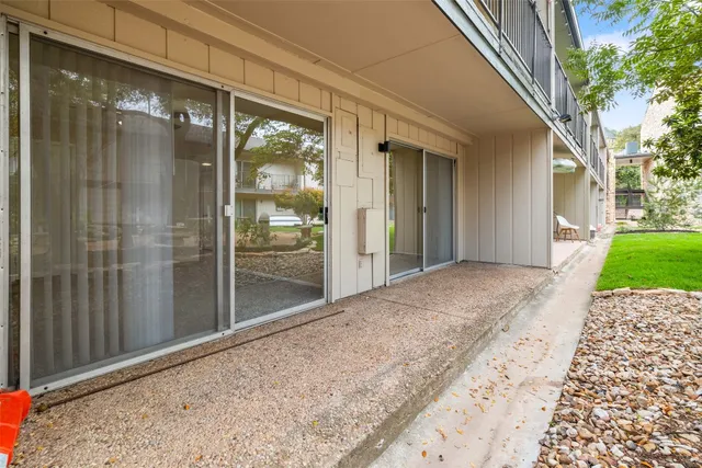 a view of backyard with patio