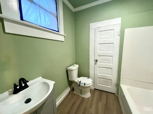 a view of a room with wooden floor