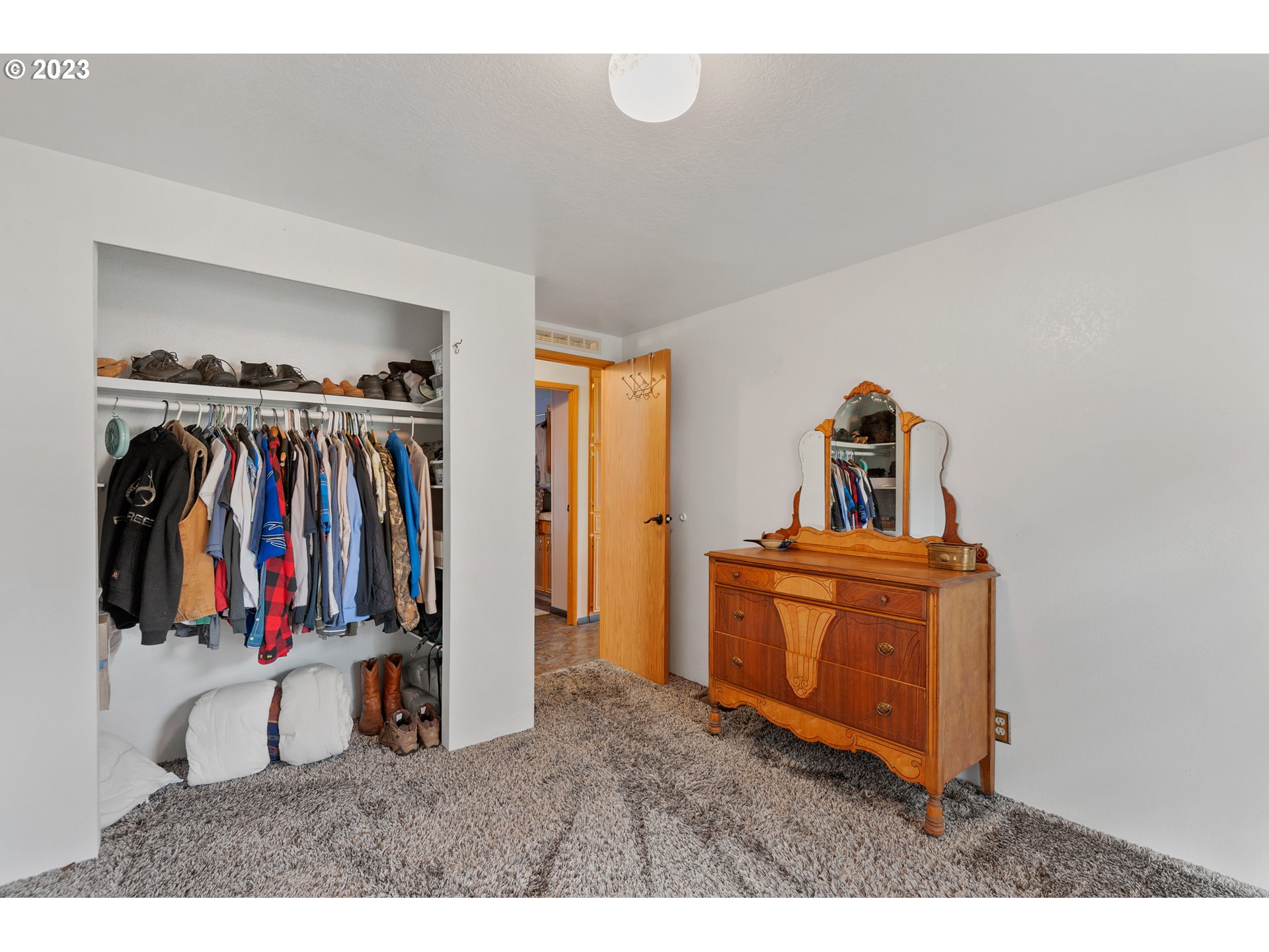 19119 Kelsey Marie Lane Southwest Rochester, WA 98579 - Photo 16 of 29 a view of walk in closet with clothes and shoes