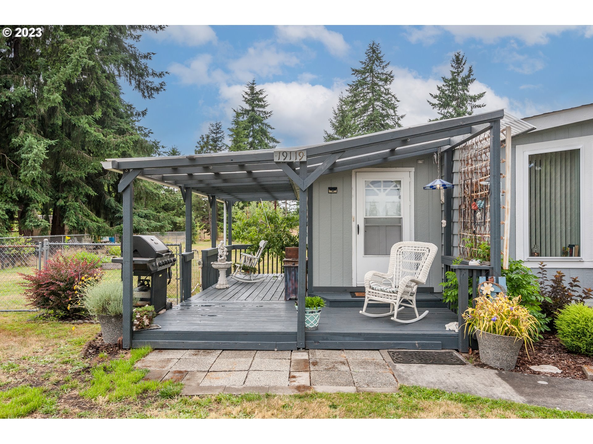 19119 Kelsey Marie Lane Southwest Rochester, WA 98579 - Photo 19 of 29 a view of a chair and table in backyard of the house