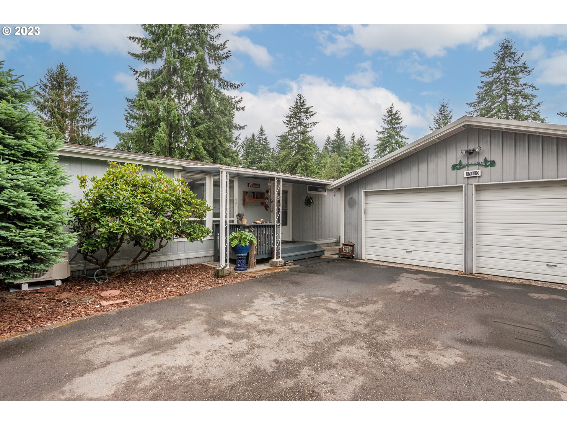 19119 Kelsey Marie Lane Southwest Rochester, WA 98579 - Photo 20 of 29 a view of a house with a backyard
