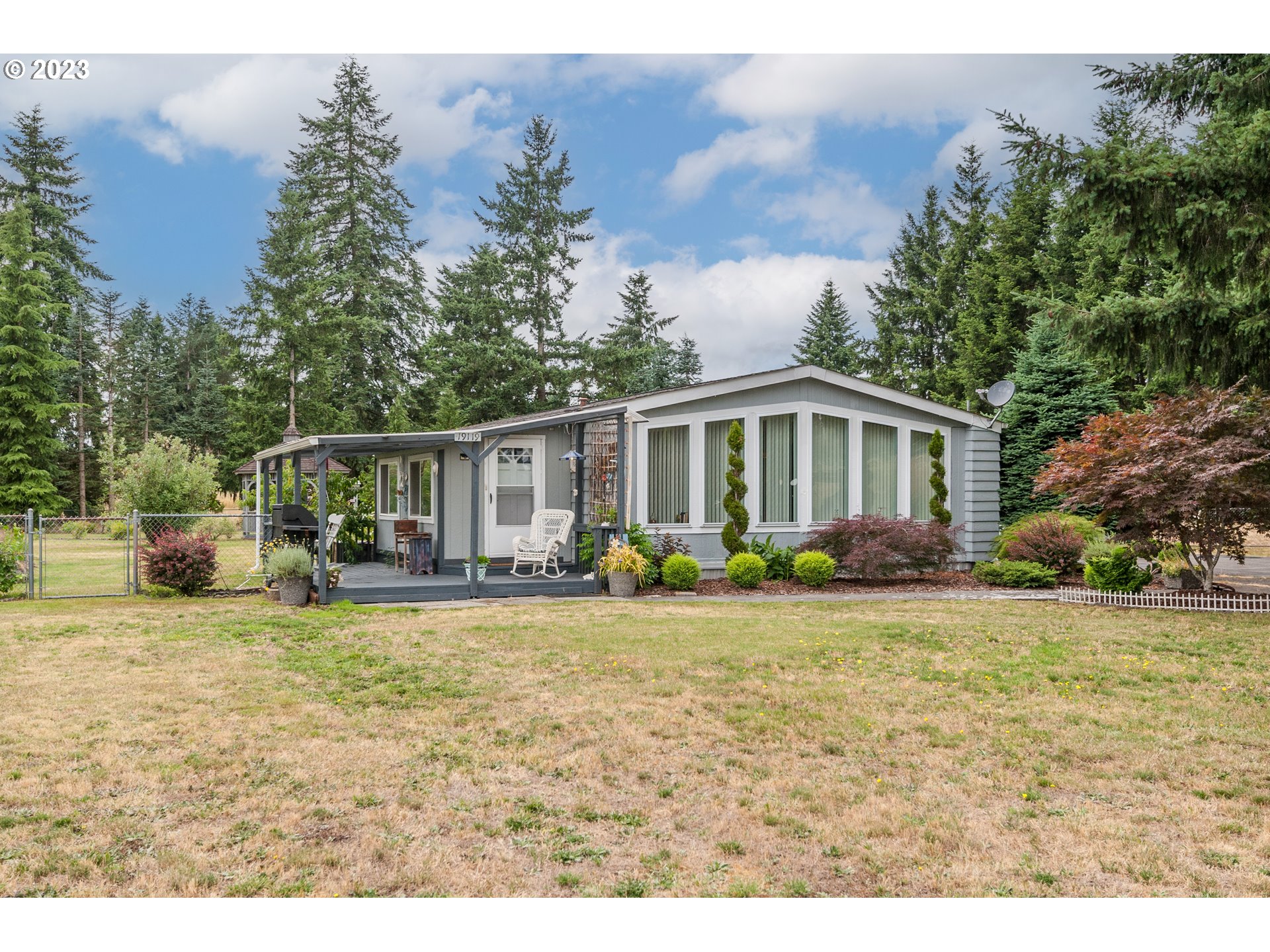 19119 Kelsey Marie Lane Southwest Rochester, WA 98579 - Photo 2 of 29 a view of a house with backyard and sitting area