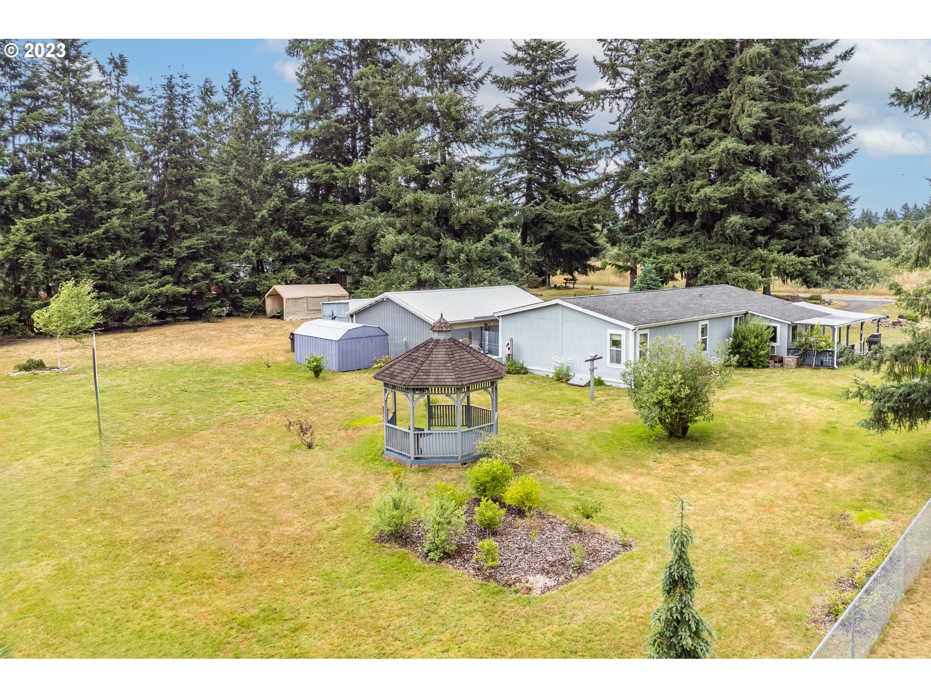 19119 Kelsey Marie Lane Southwest Rochester, WA 98579 - Photo 28 of 29 a view of a house with a yard