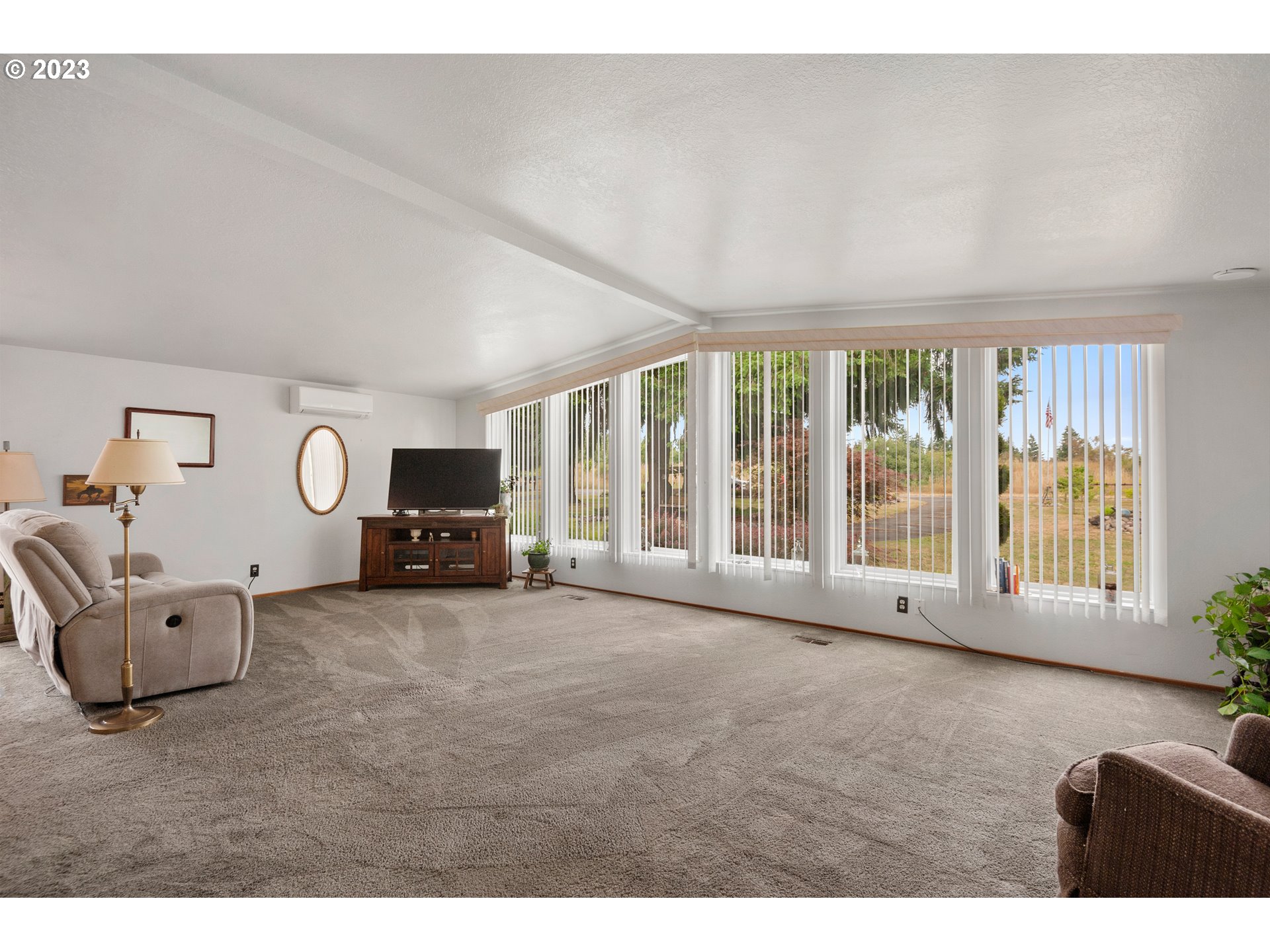 19119 Kelsey Marie Lane Southwest Rochester, WA 98579 - Photo 3 of 29 a living room with furniture and a large window