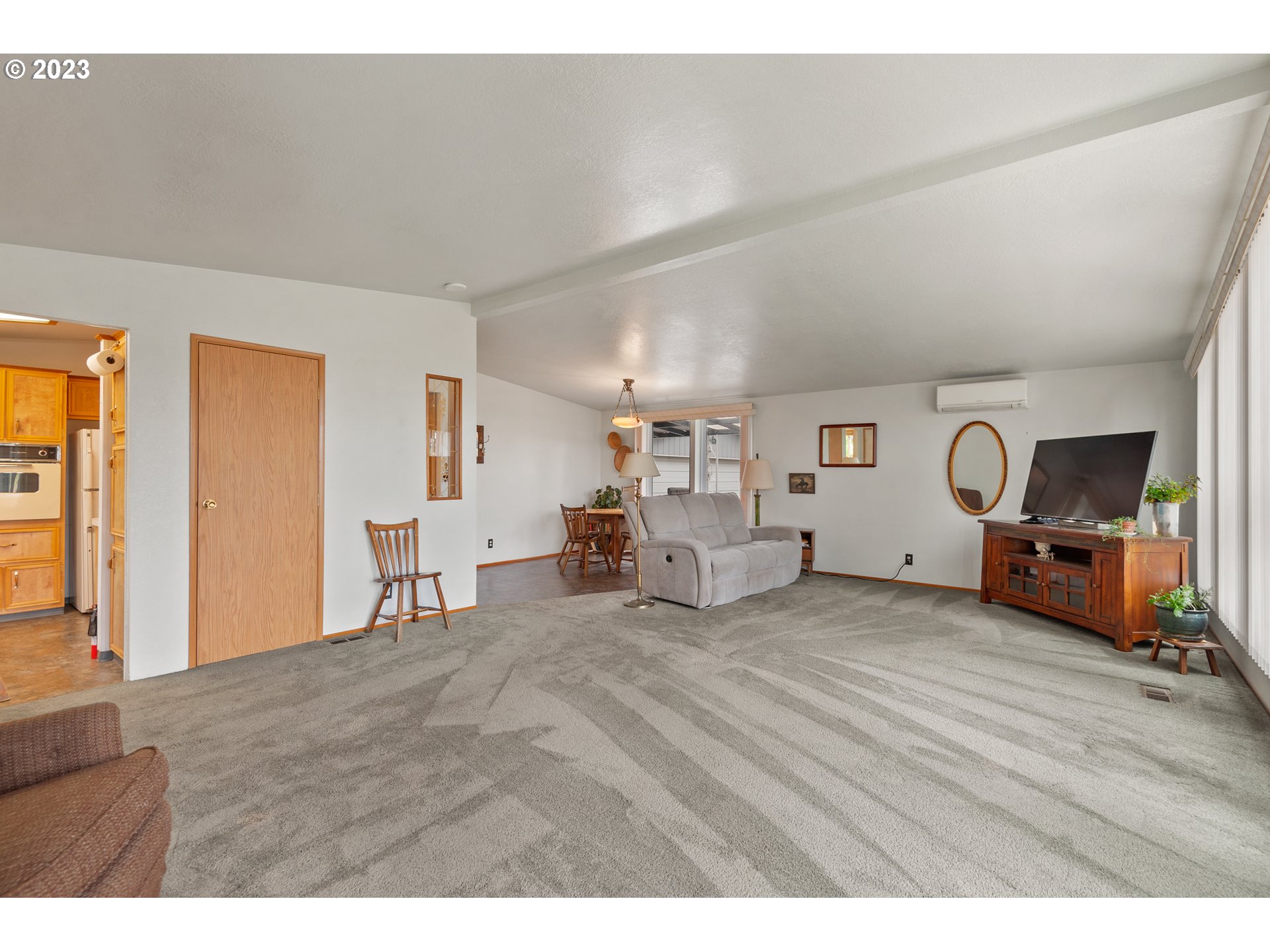 19119 Kelsey Marie Lane Southwest Rochester, WA 98579 - Photo 5 of 29 a view of a livingroom with furniture and a flat screen tv