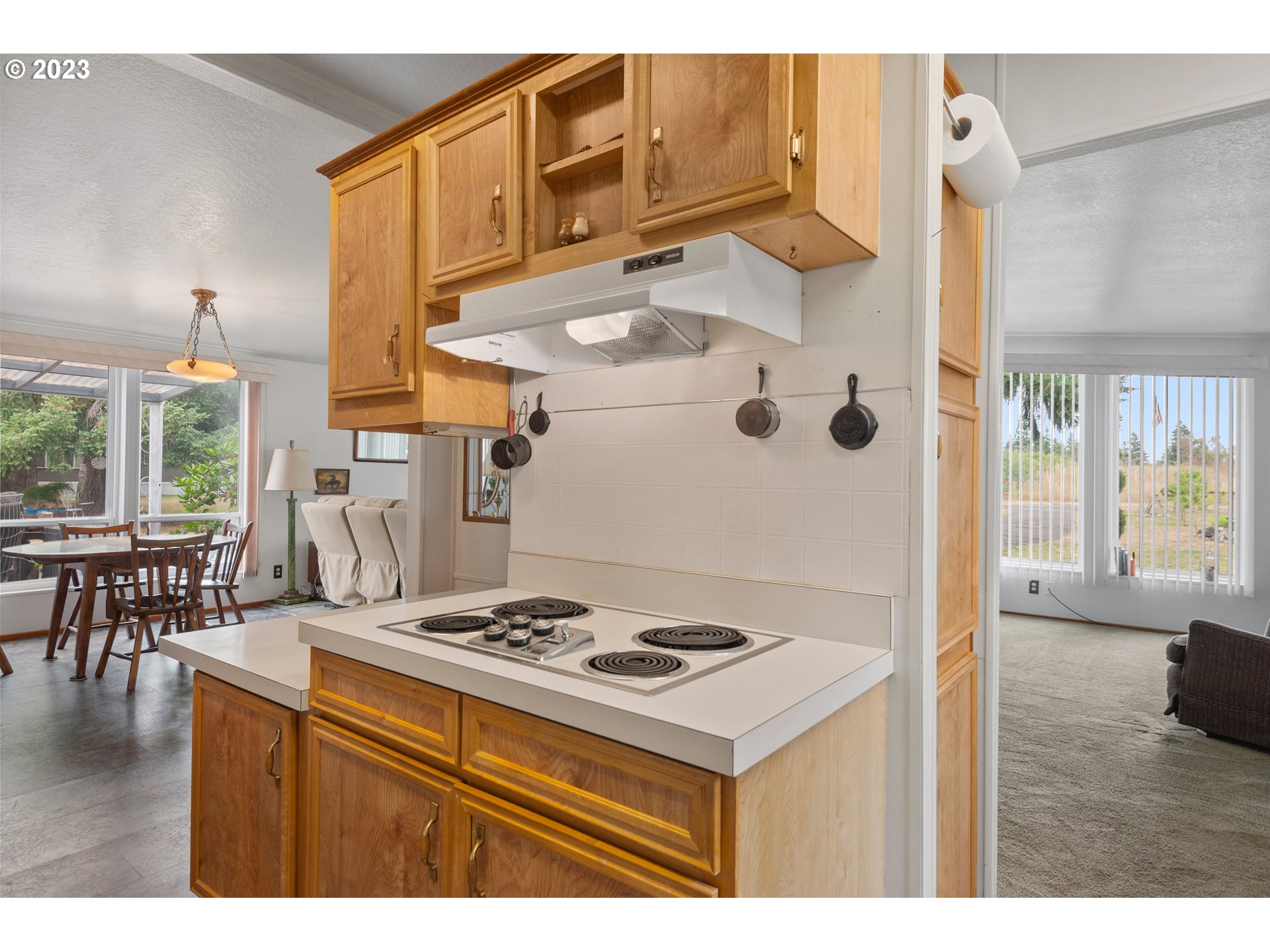 19119 Kelsey Marie Lane Southwest Rochester, WA 98579 - Photo 9 of 29 a kitchen with a sink a stove and a refrigerator