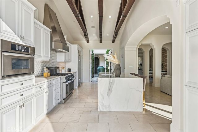 a kitchen with a sink cabinets and window