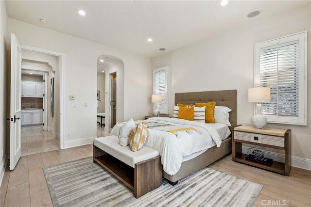 a bedroom with a bed and a lamp