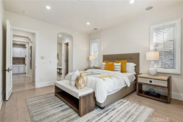 a bedroom with a bed and a lamp