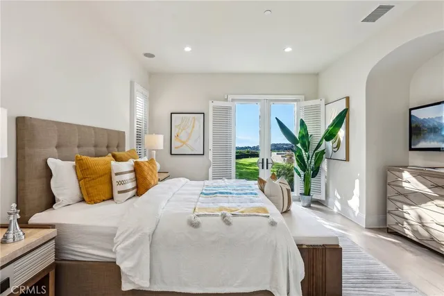 a bedroom with a bed and a night stand