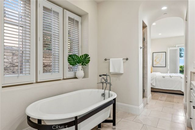 a bathroom with a sink mirror and toilet