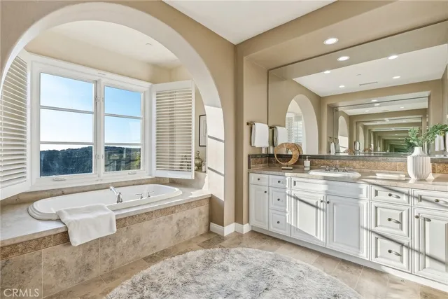 a view of a patio with a table chairs and a floor to ceiling window