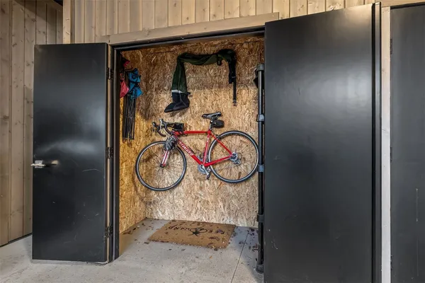 a view of a patio with table and chairs with wooden floor and fence