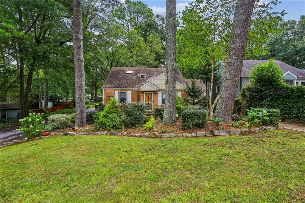 586 Daniel Avenue Decatur, GA 30032 - Photo 1 of 1 a front view of a house with a yard
