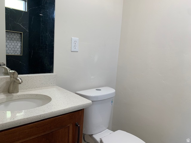 1500 North Angel Street West, Unit 56 Layton, UT 84041 - Photo 14 of 20 Bathroom with vanity and toilet
