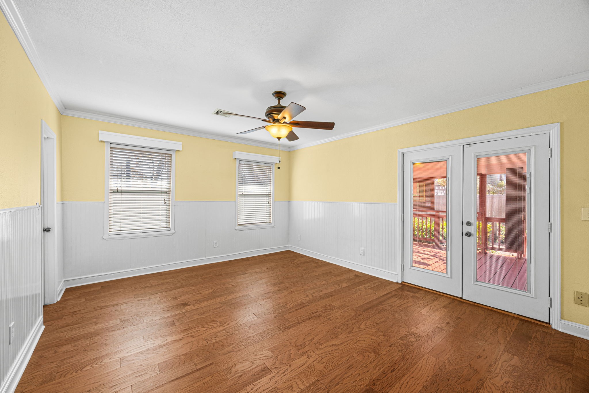 710 East 28th Street Houston, TX 77009 - Photo 11 of 44 a view of empty room with wooden floor and fan