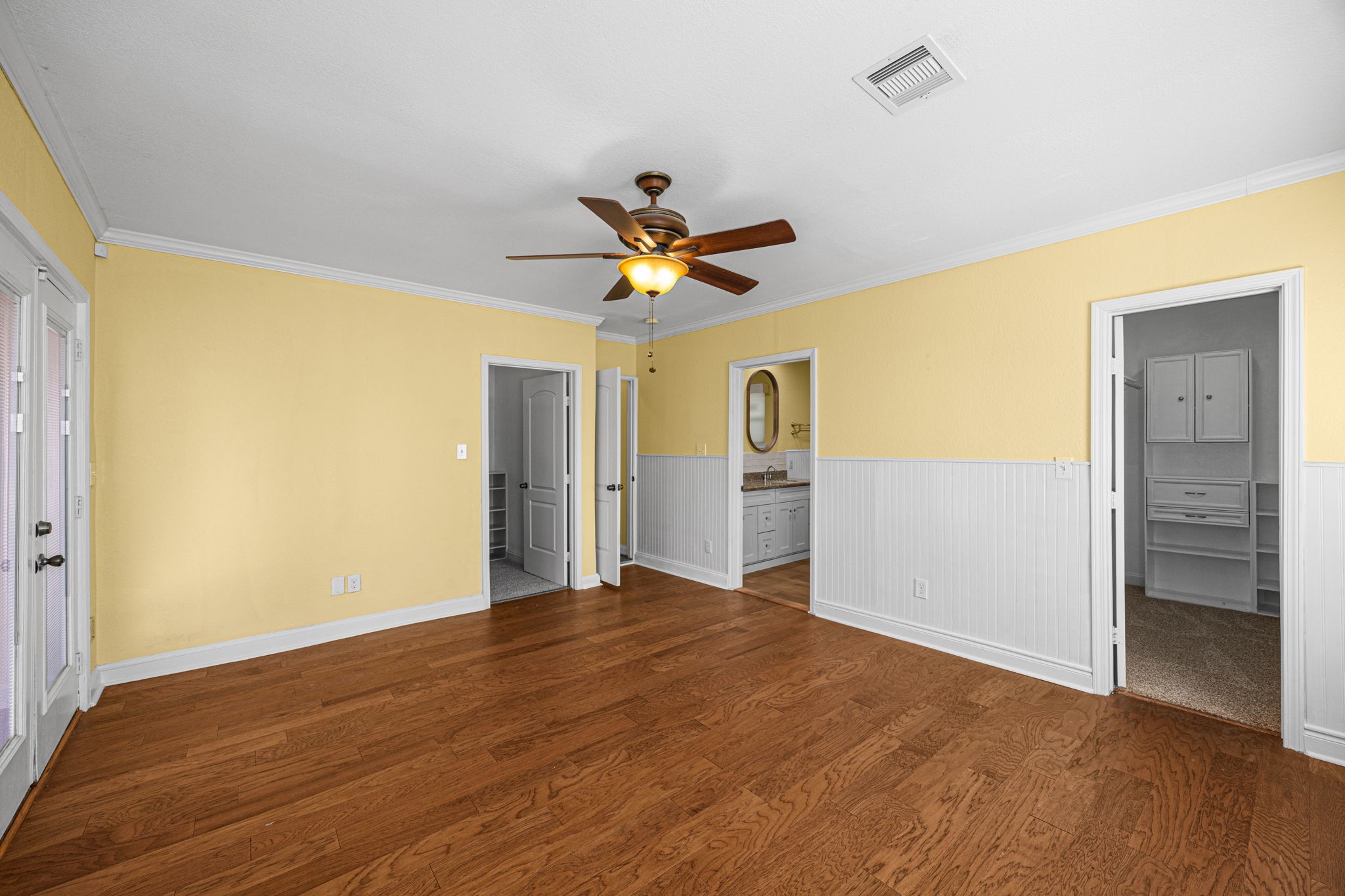 710 East 28th Street Houston, TX 77009 - Photo 12 of 44 a view of a livingroom with a ceiling fan wooden floor and a ceiling fan