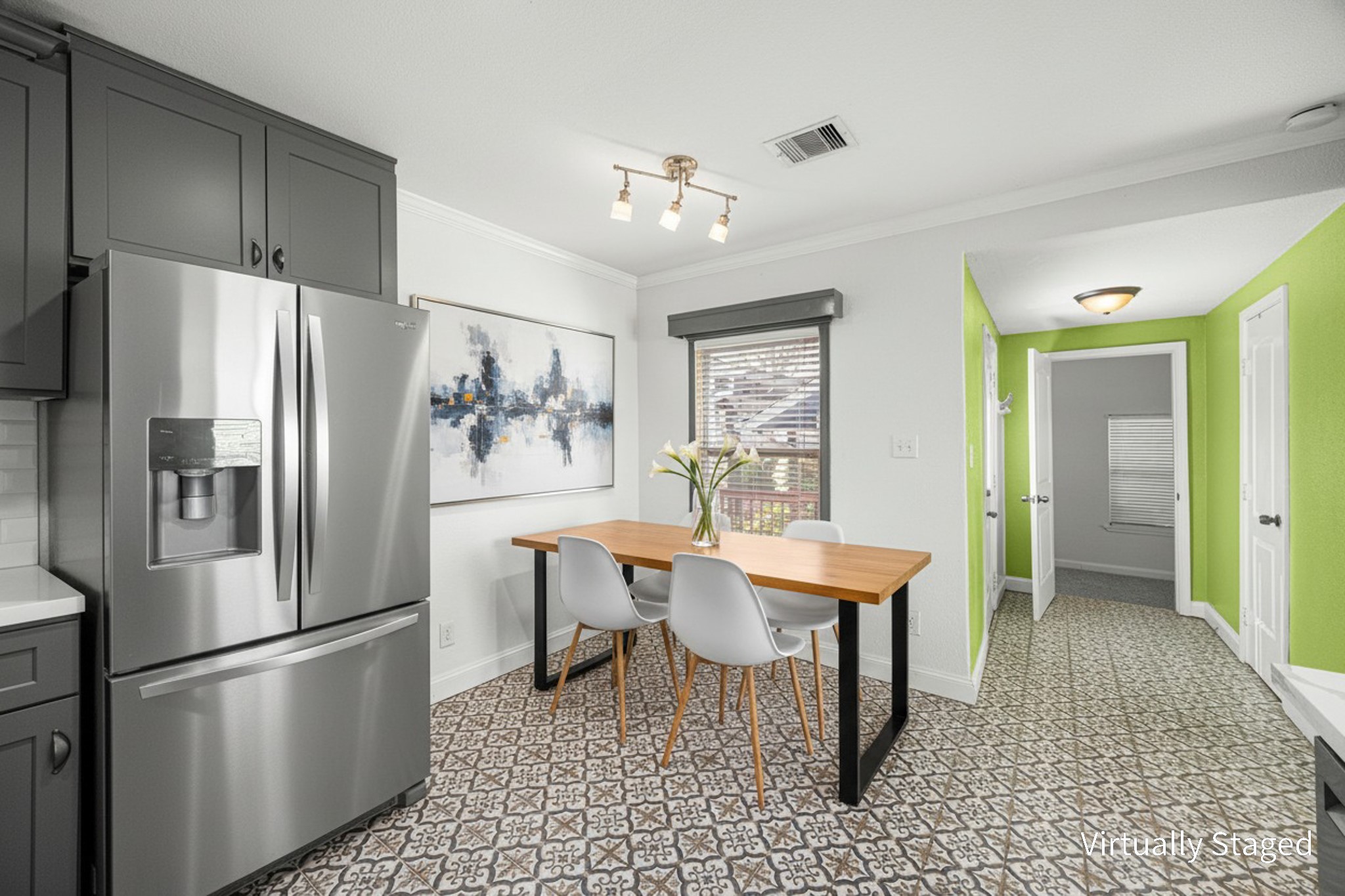 710 East 28th Street Houston, TX 77009 - Photo 25 of 44 a kitchen with stainless steel appliances refrigerator dining table and chairs