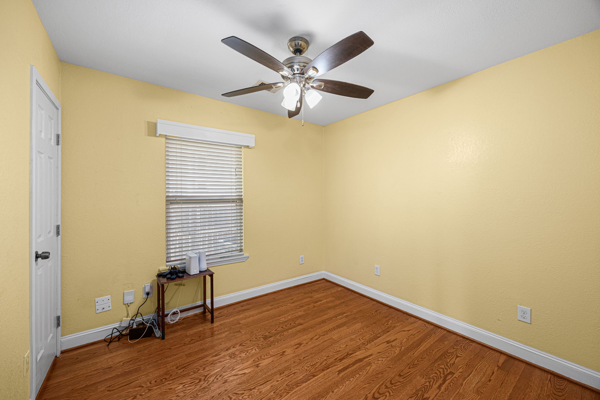 710 East 28th Street Houston, TX 77009 - Photo 28 of 44 a view of room with a ceiling fan and wooden floor