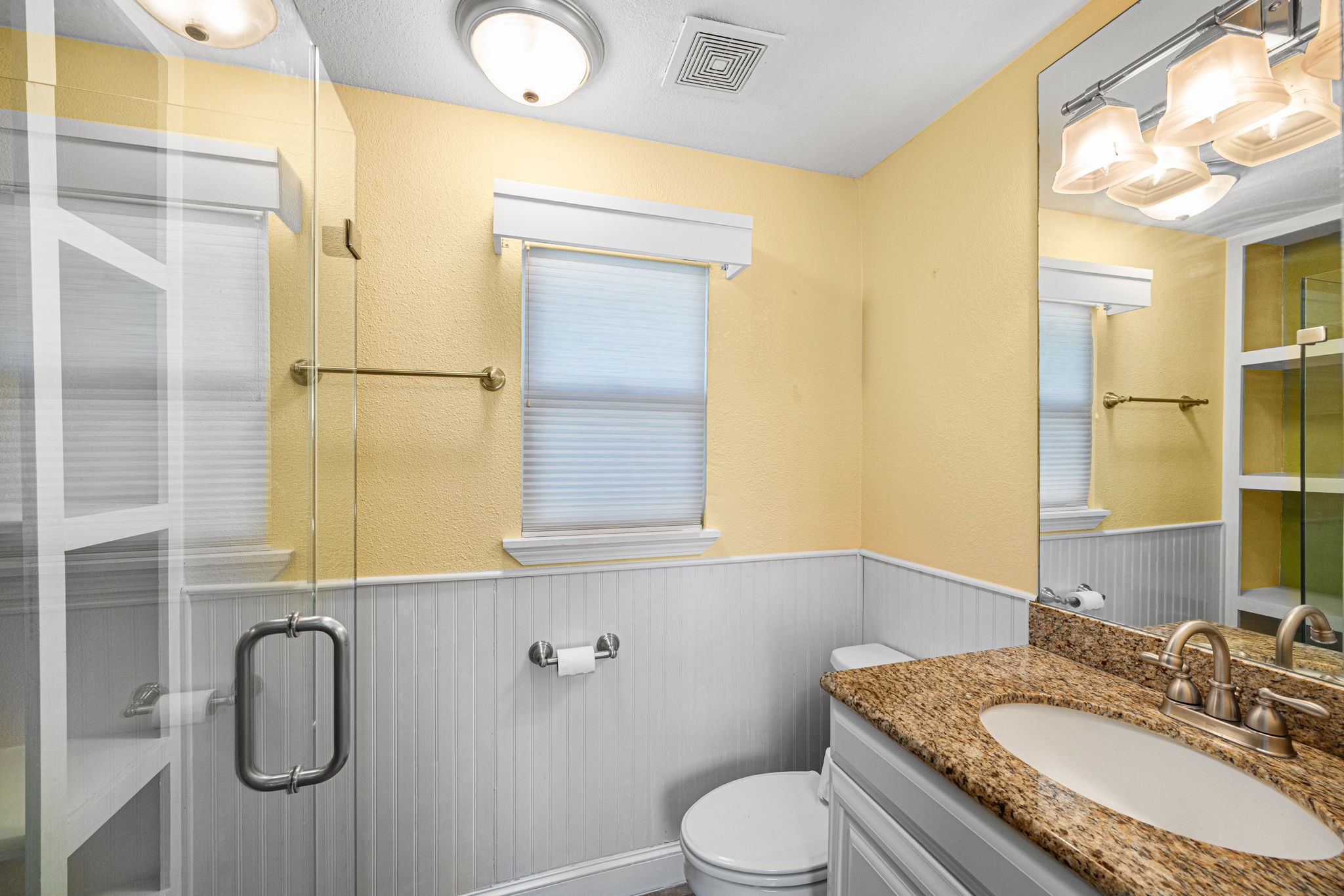 710 East 28th Street Houston, TX 77009 - Photo 33 of 44 a bathroom with a granite countertop sink toilet and shower